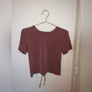 Only worn once! Adjustable fit because of the tie in the back. Really soft!!